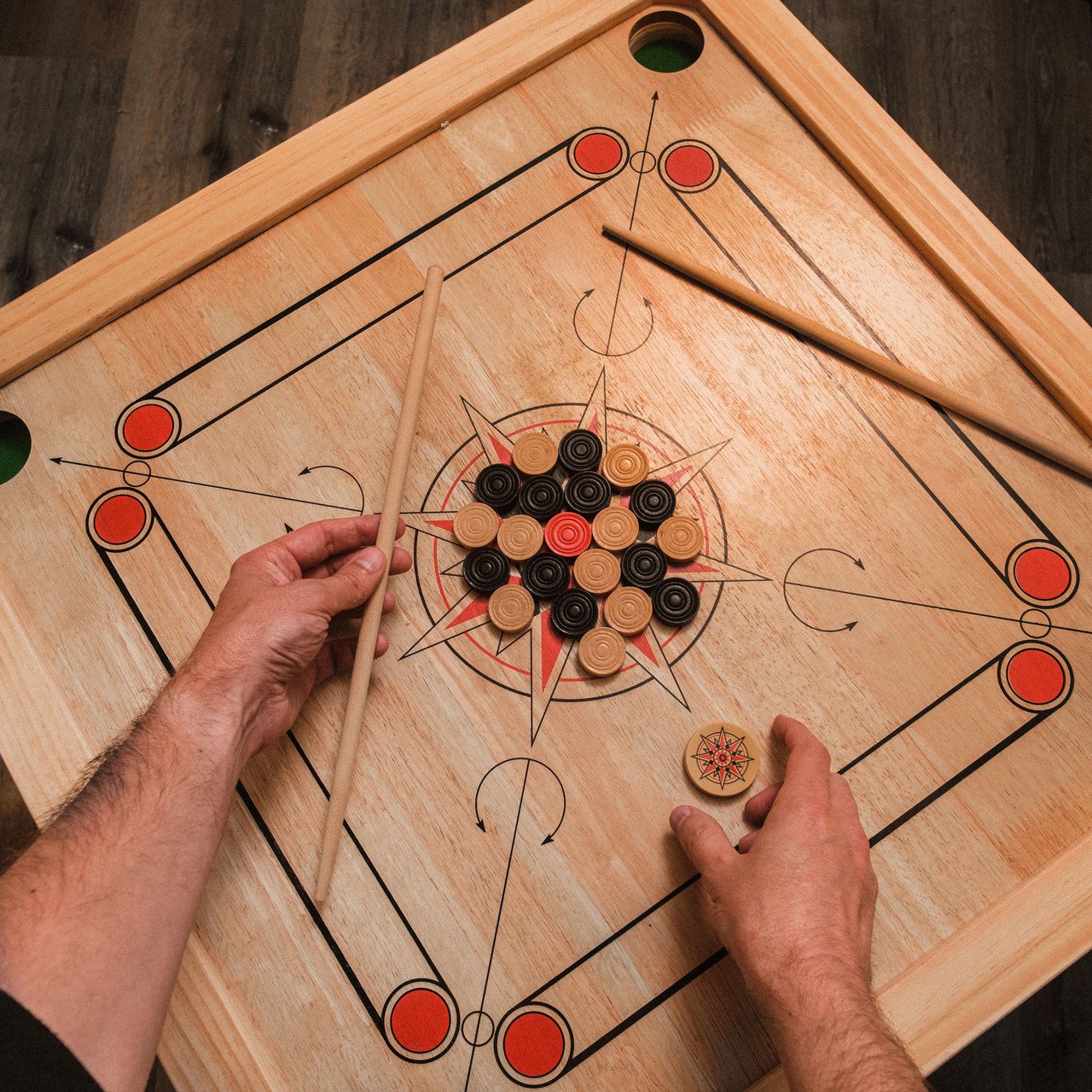 Carrom board game in lounge